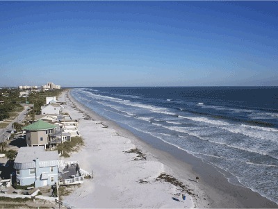 The beach front view from a condo balcony